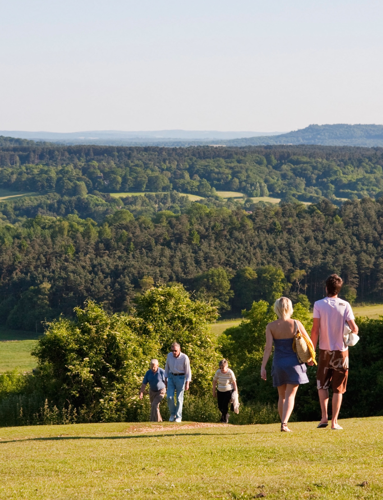 People walking on The North Downs viewed from Newlands Corner Guildford